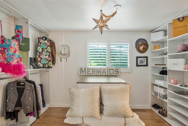 interior space featuring wood finished floors and baseboards