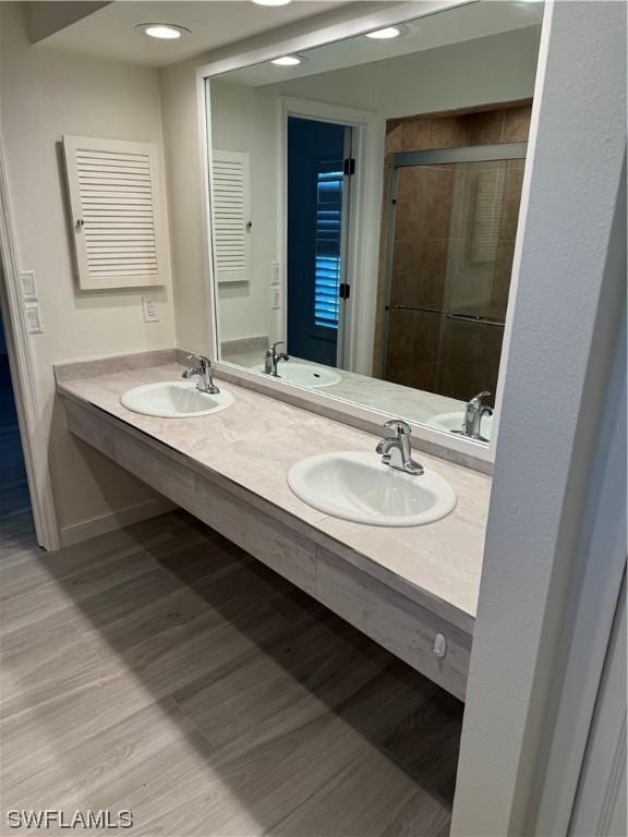 bathroom with vanity and walk in shower