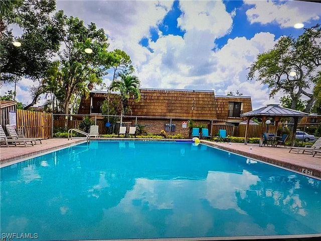 view of pool featuring a gazebo and a patio area