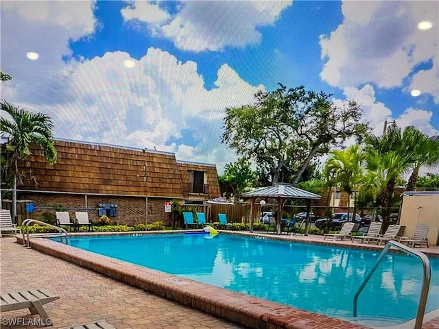 view of swimming pool with a patio