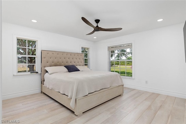 bedroom featuring light wood-type flooring and ceiling fan