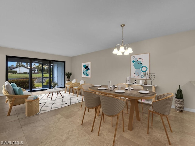 dining area with an inviting chandelier