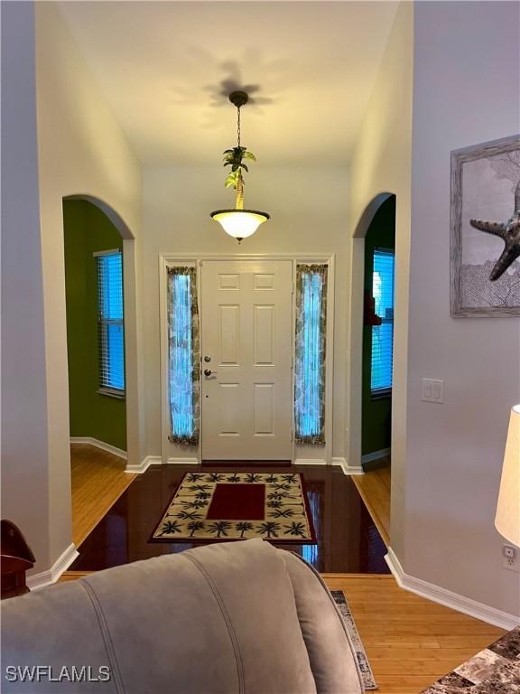 entryway with hardwood / wood-style flooring