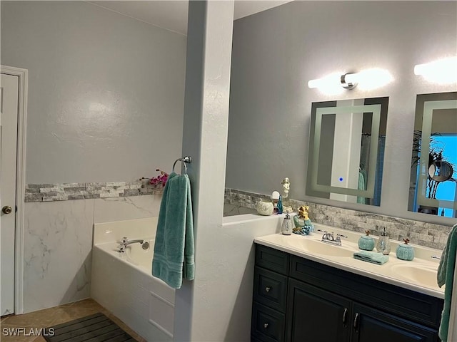 bathroom featuring a bath and vanity