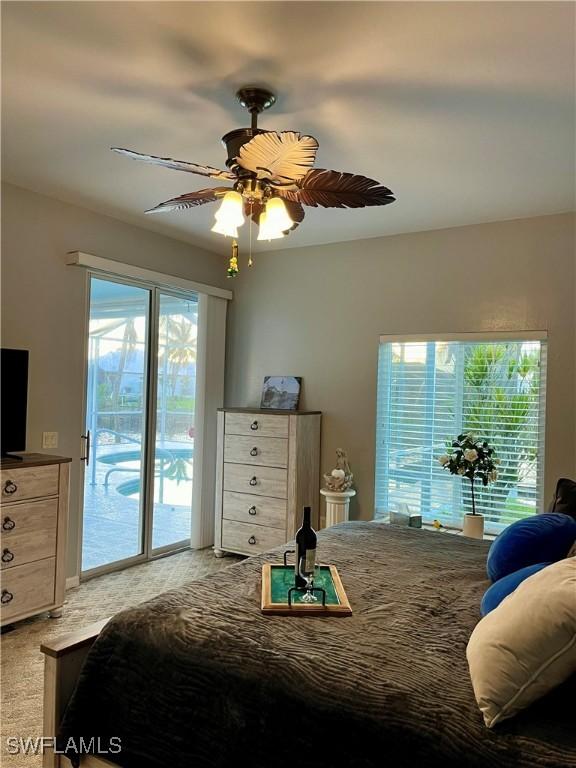 bedroom featuring ceiling fan, access to outside, and light carpet