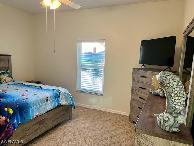 bedroom featuring light colored carpet