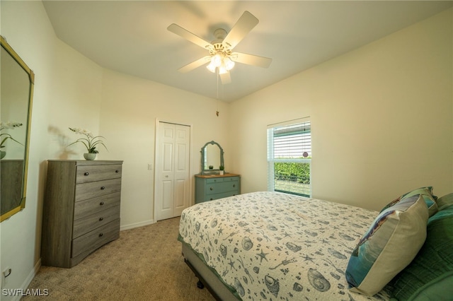 bedroom with a closet, carpet flooring, and ceiling fan