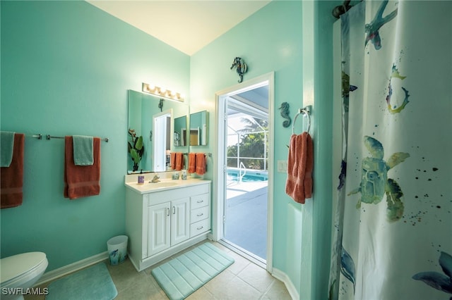 bathroom featuring vanity, toilet, and tile patterned floors