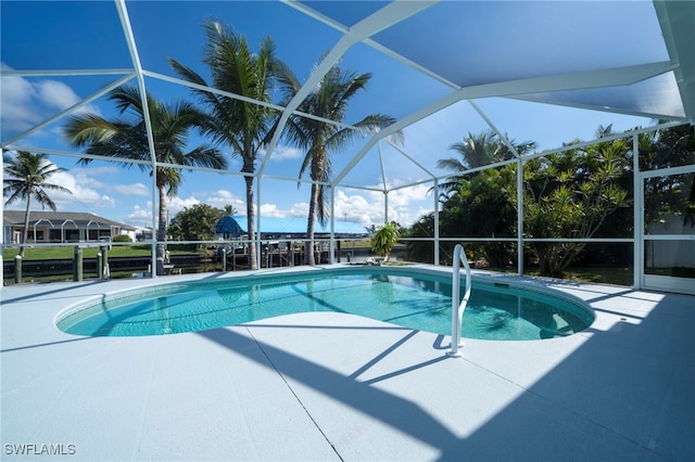 view of pool with a lanai