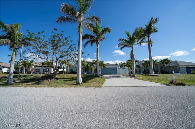 view of front of home with a garage and a front yard