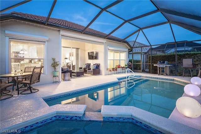 view of swimming pool with glass enclosure, a patio, and a grill