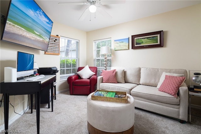 carpeted living room featuring ceiling fan