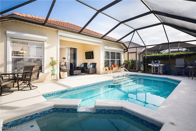 view of swimming pool with area for grilling, a lanai, and a patio area