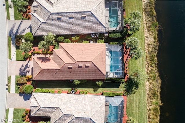 birds eye view of property with a water view