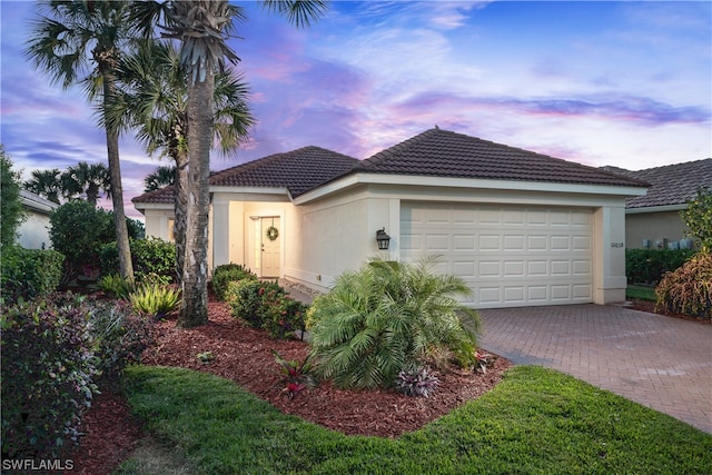 view of front of property with a garage