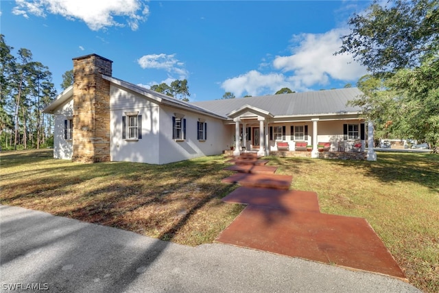 view of front of property with a front lawn and a porch