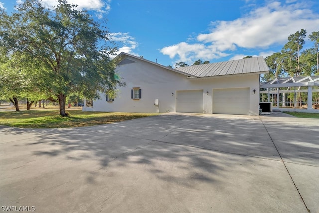 view of property exterior with a garage