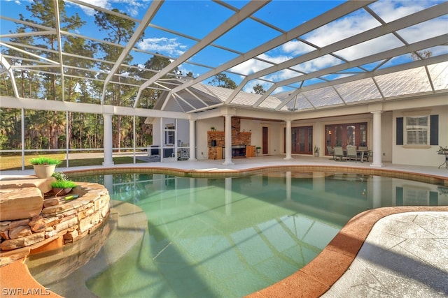 view of swimming pool with a lanai and a patio