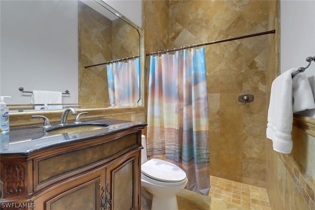 bathroom with toilet, vanity, and a shower with shower curtain