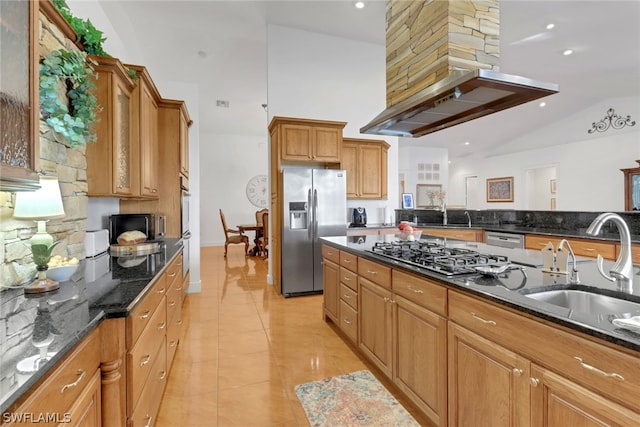 kitchen with custom exhaust hood, lofted ceiling, stainless steel appliances, and dark stone counters