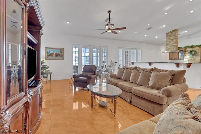 living room featuring ceiling fan, light tile patterned flooring, and french doors