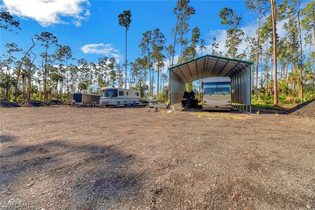 view of yard featuring a carport