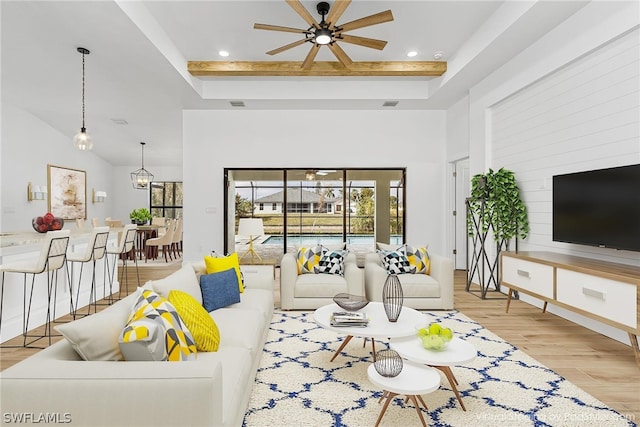 living room featuring light wood finished floors, visible vents, a towering ceiling, ceiling fan, and recessed lighting