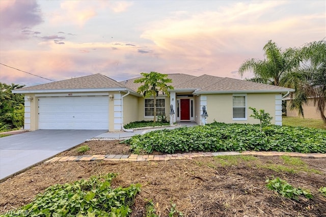 single story home featuring a garage