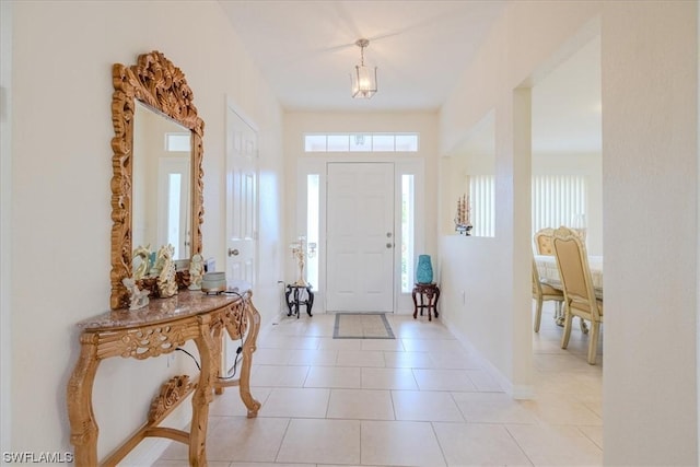 tiled foyer entrance featuring a healthy amount of sunlight