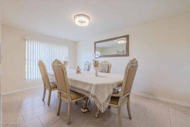 dining area featuring light tile patterned flooring