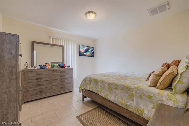 bedroom featuring light tile patterned floors