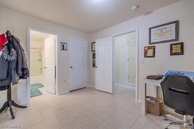 home office featuring light tile patterned floors