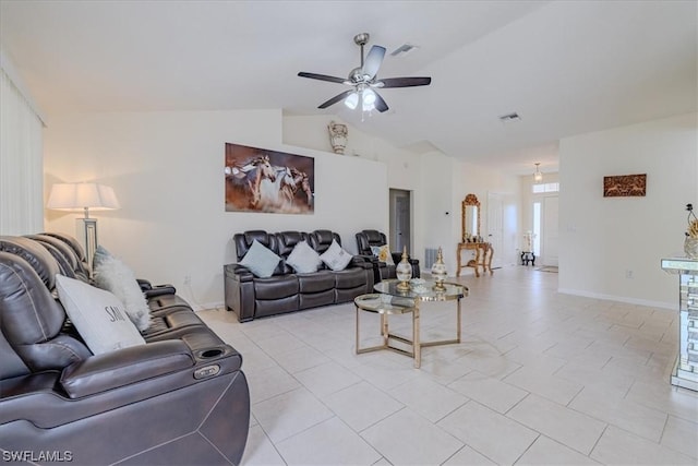 living room with ceiling fan, light tile patterned floors, and vaulted ceiling