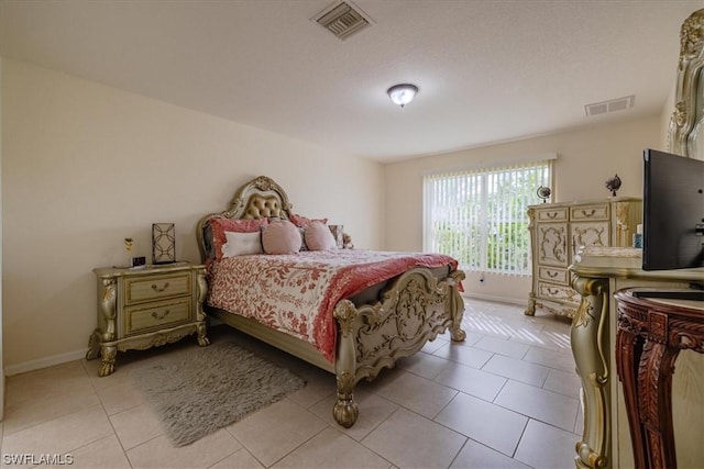 bedroom with light tile patterned flooring