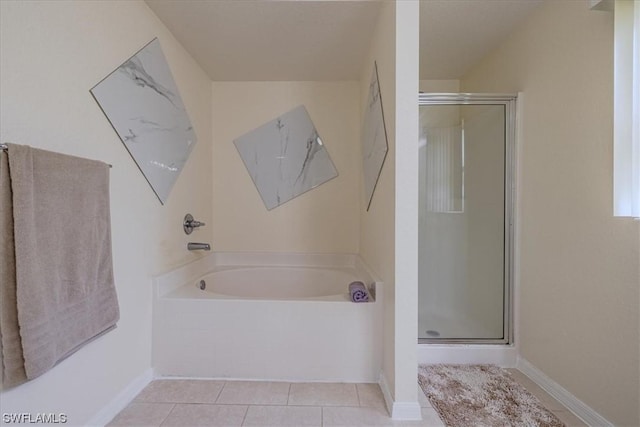 bathroom featuring shower with separate bathtub and tile patterned flooring