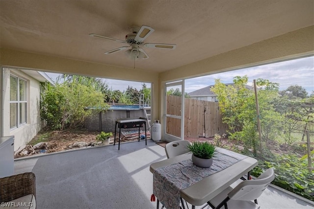 sunroom / solarium with ceiling fan