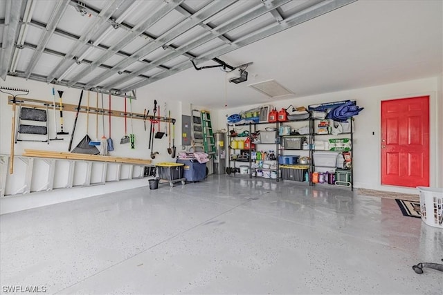 garage featuring a garage door opener