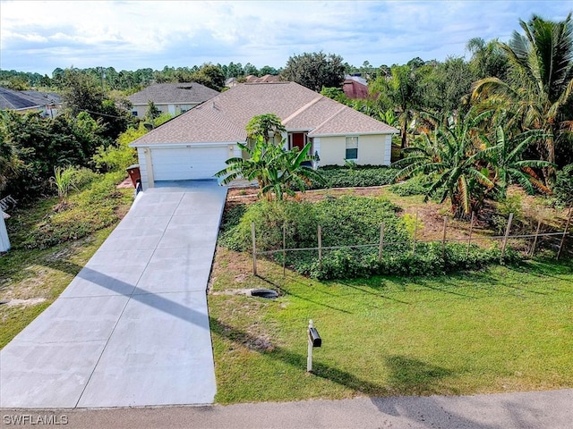 view of front facade featuring a front yard and a garage