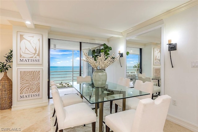 dining area featuring beam ceiling, crown molding, and a water view