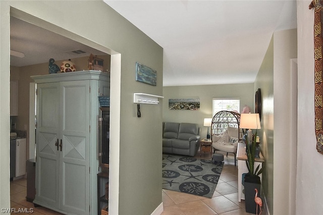 hall with light tile patterned flooring