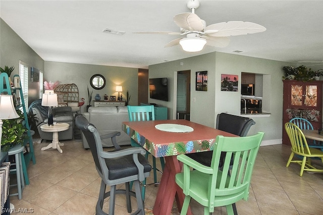 dining room featuring ceiling fan and light tile patterned floors