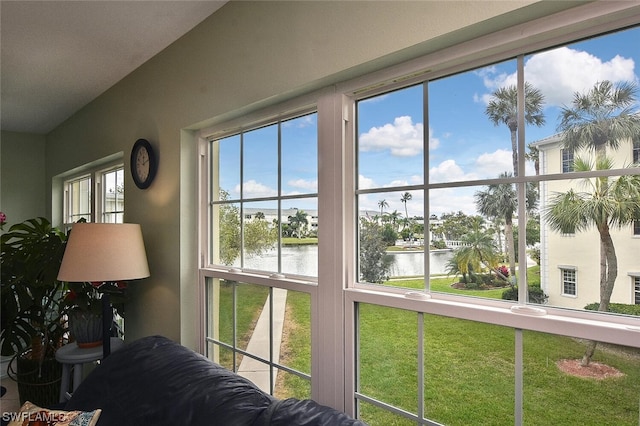 interior space featuring a water view and a wealth of natural light