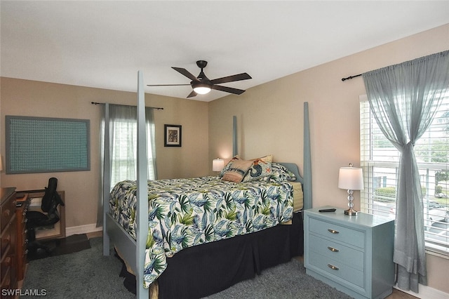 bedroom with multiple windows and ceiling fan