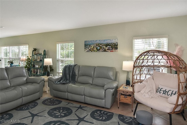 tiled living room with a wealth of natural light