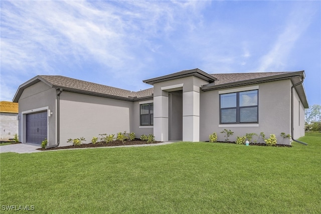 view of front of property with a garage and a front yard