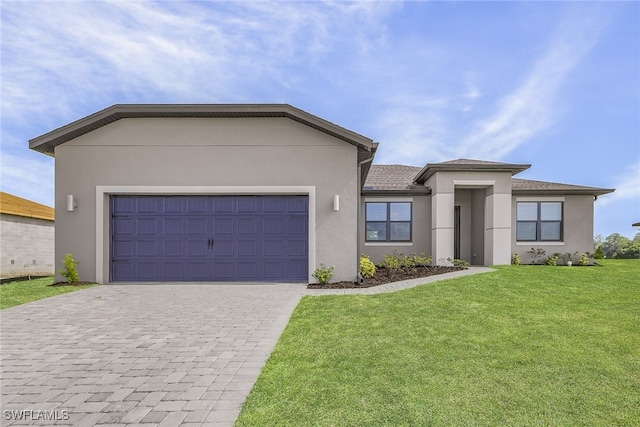 view of front of home featuring a garage and a front yard