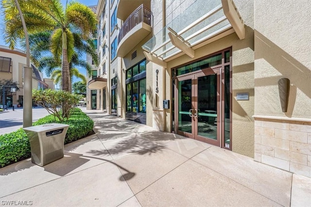 view of exterior entry featuring french doors