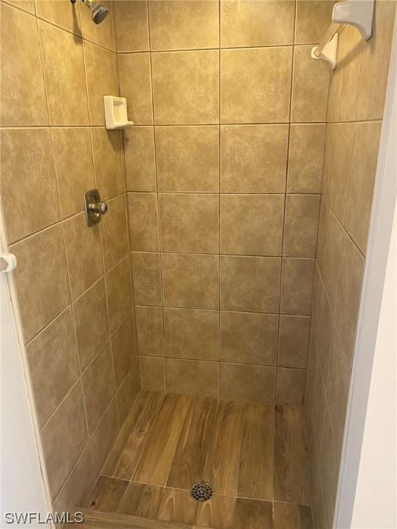 bathroom with tiled shower