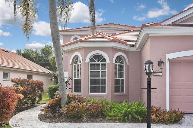 view of property exterior featuring a garage