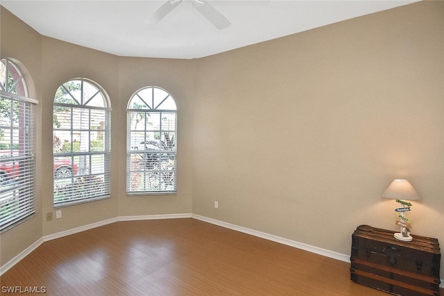 empty room featuring hardwood / wood-style floors and ceiling fan